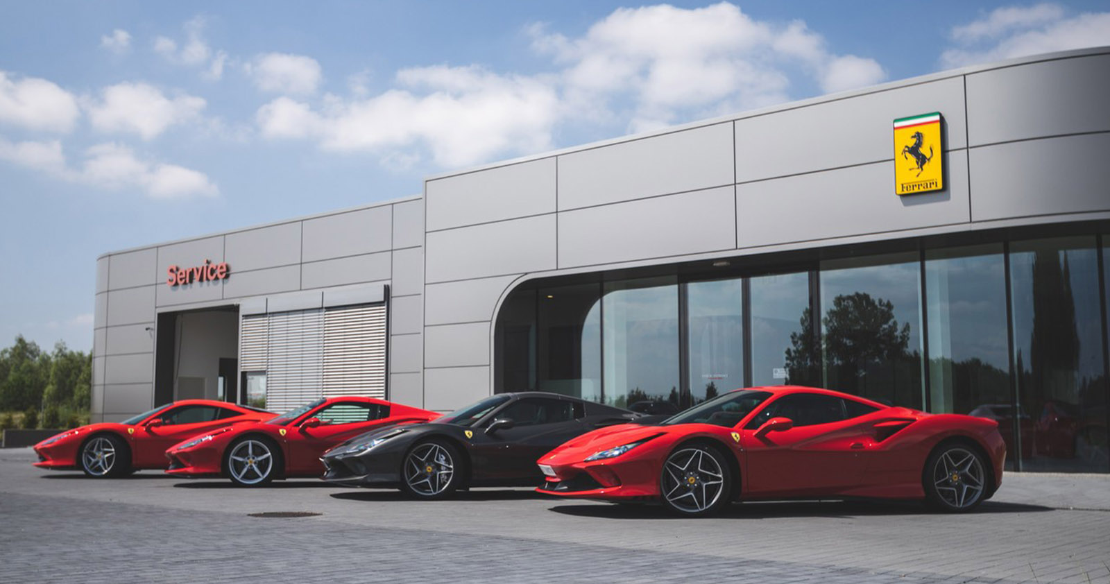 Ferraris at the front of a dealership