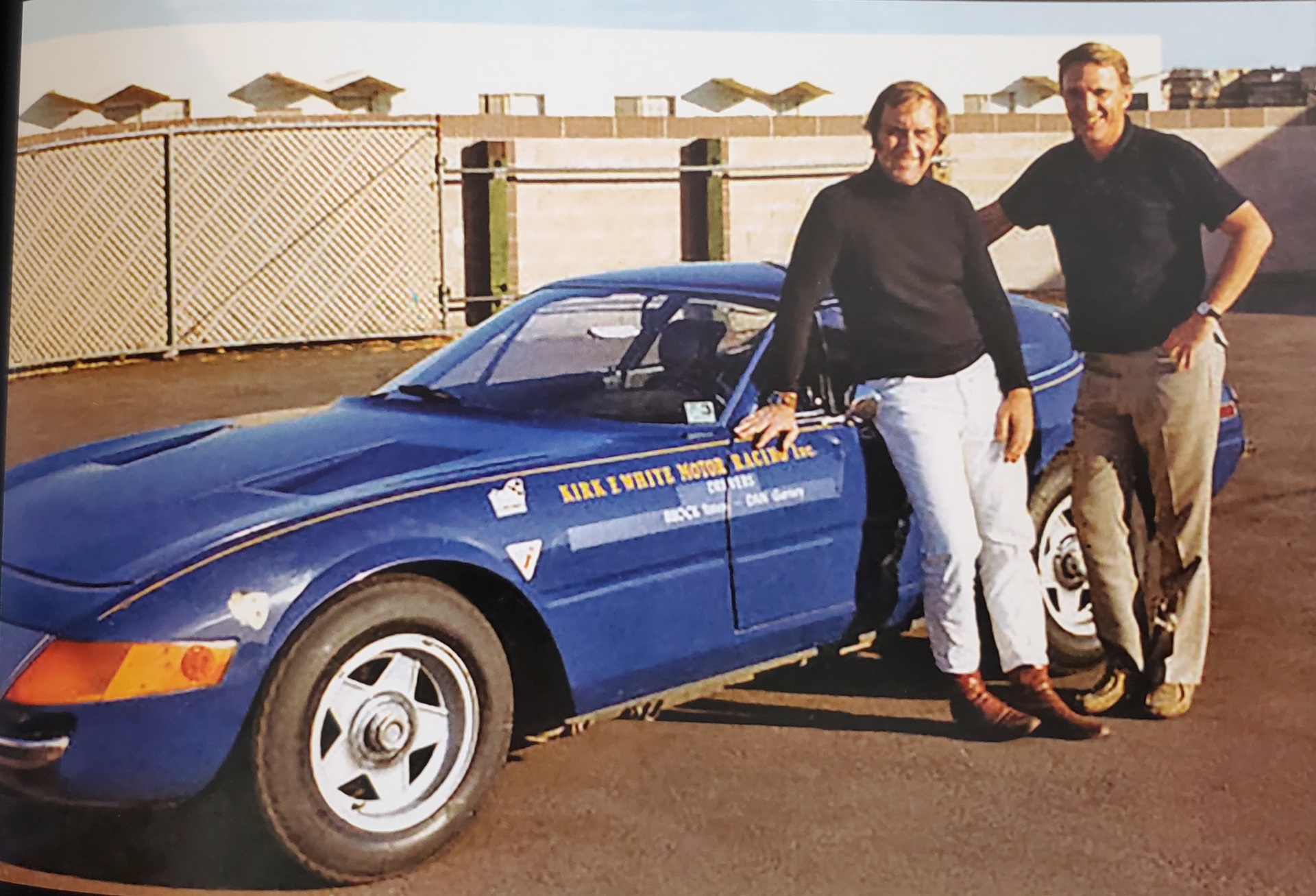 Brock Yates and Dan Gurney standing next to Ferrari 365GTB4 in first Cannonball rally