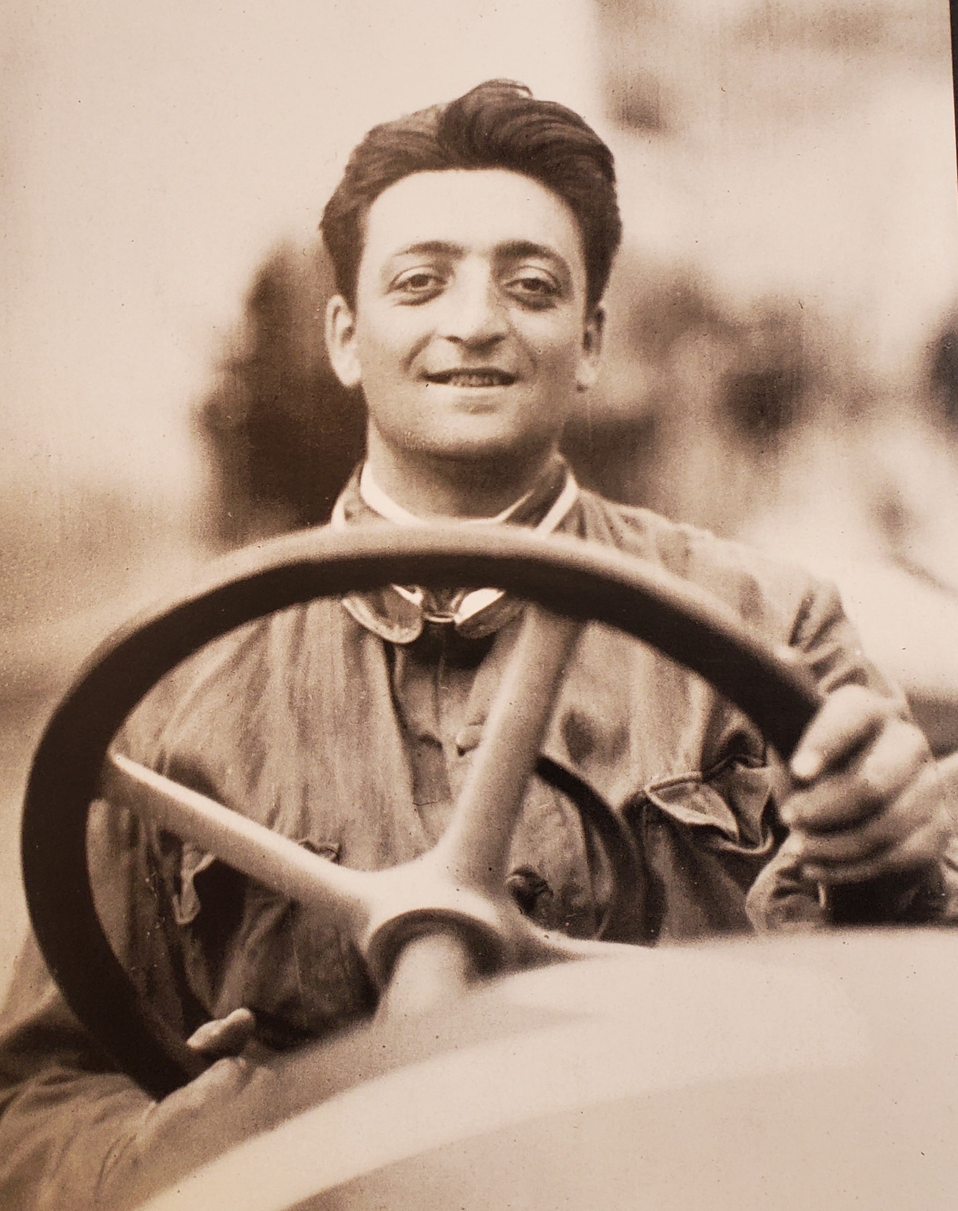 Black and white photo of Enzo Ferrari